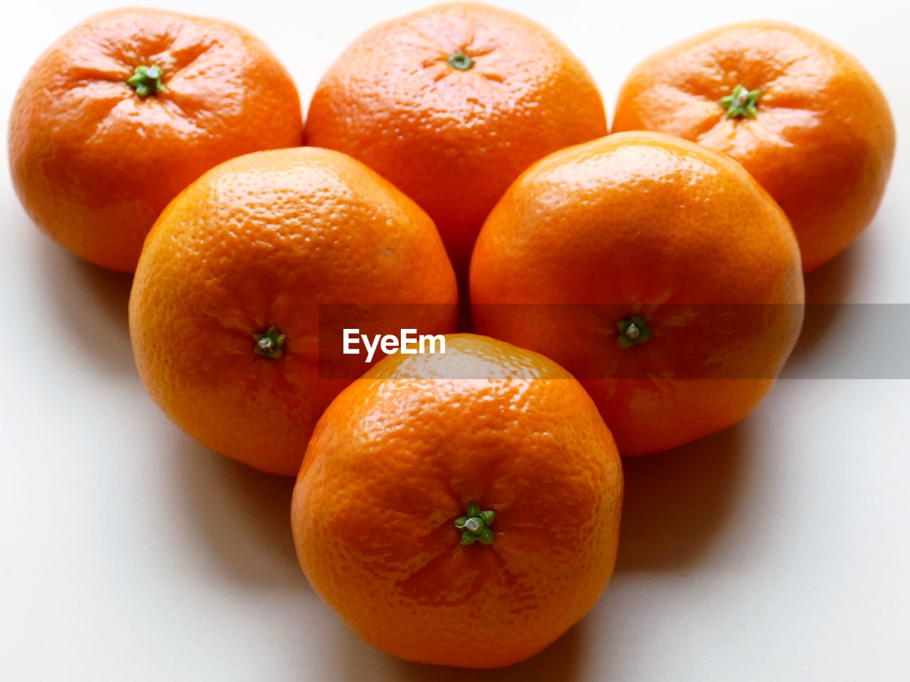 Close-up of oranges against orange background