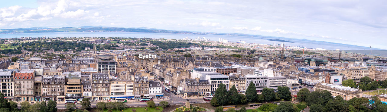 HIGH ANGLE VIEW OF TOWNSCAPE AND BUILDINGS AGAINST SKY