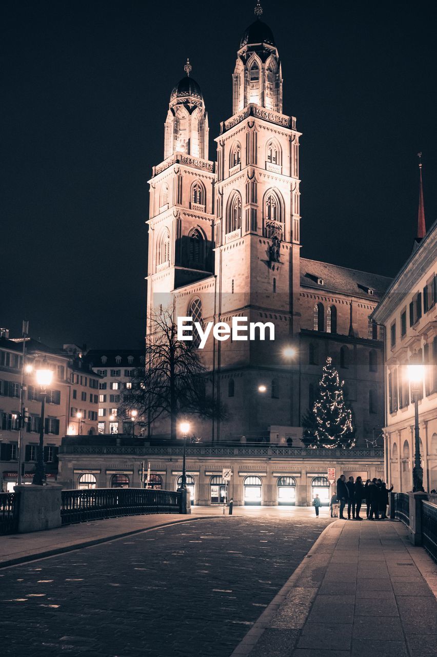 Illuminated church in city at night