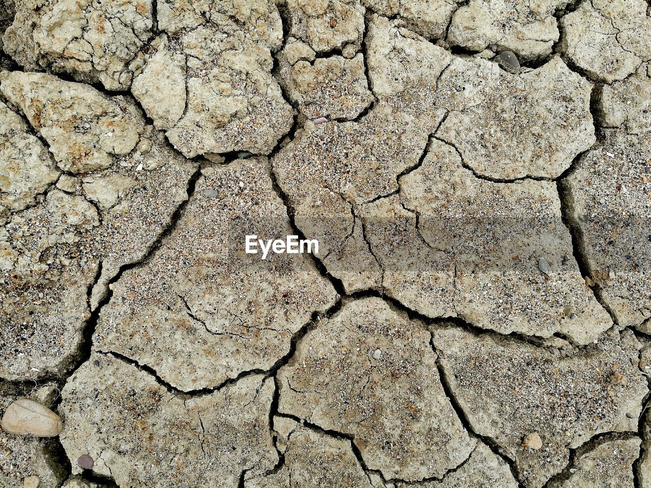 High angle view of cracked field