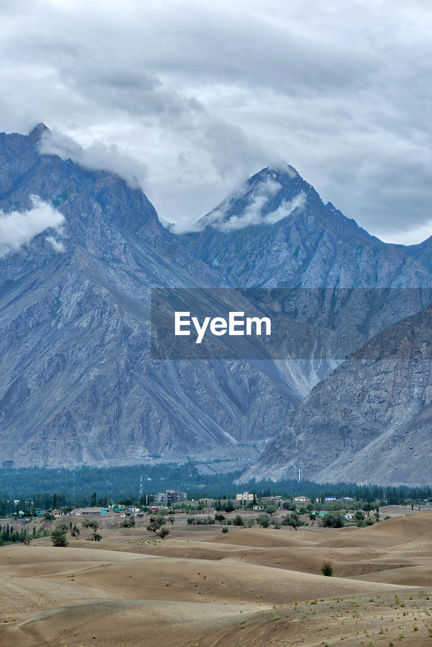 Scenic view of snowcapped mountains against sky