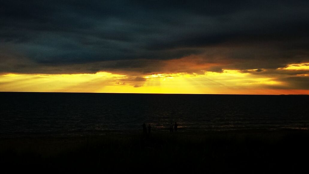 SCENIC VIEW OF SEA AT SUNSET