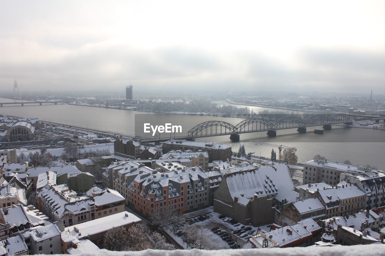 High angle view of bridge over river against buildings