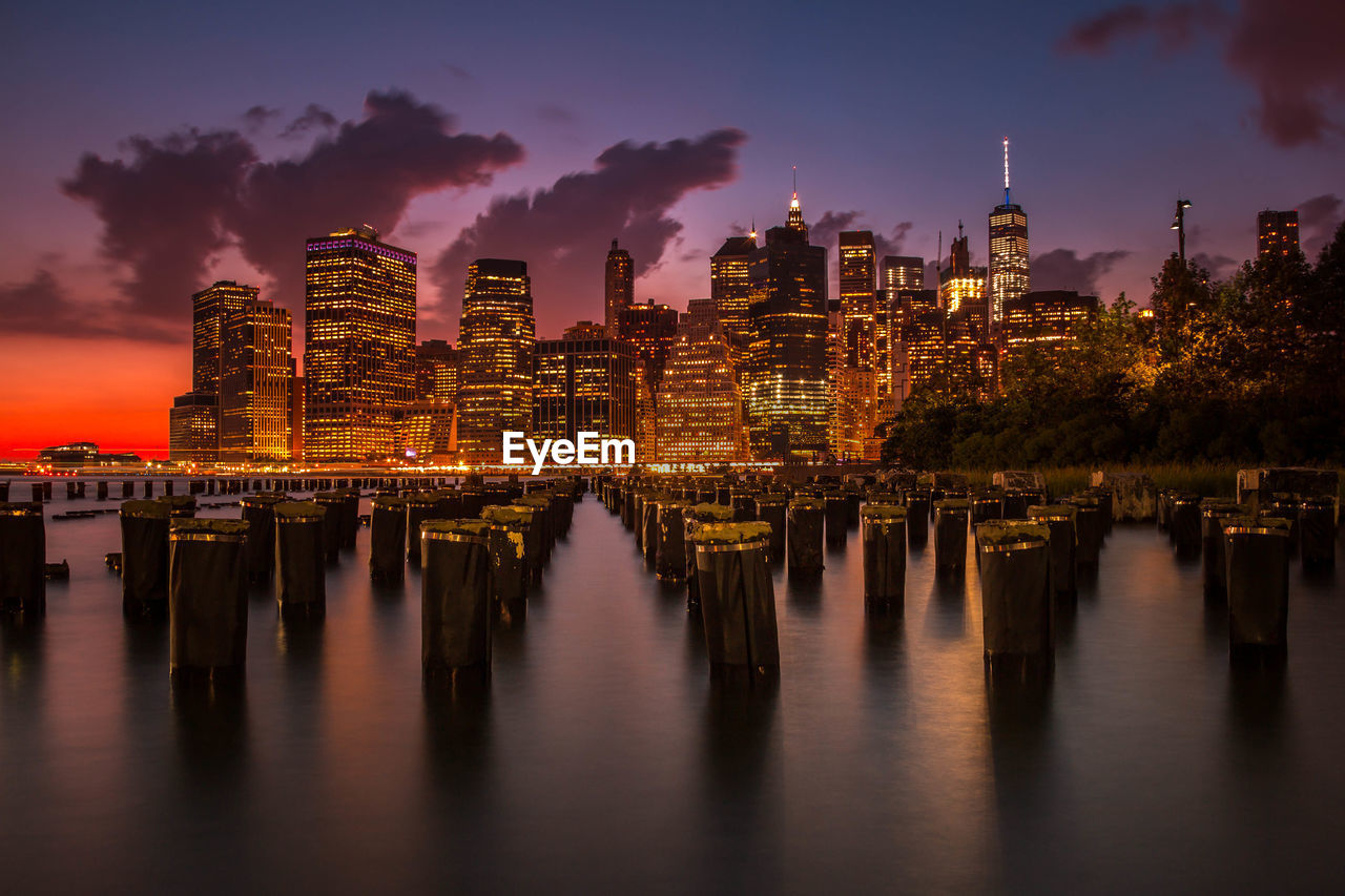 Scenic view of illuminated cityscape at dusk