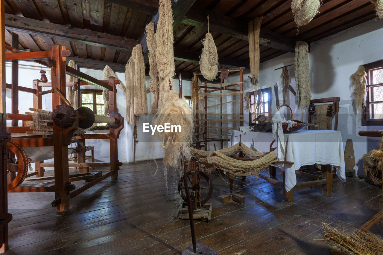 VIEW OF EMPTY CHAIRS AND TABLES IN ROOM