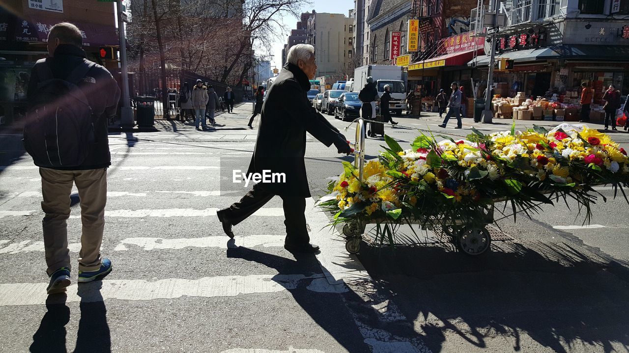 WOMAN STANDING ON FOOTPATH