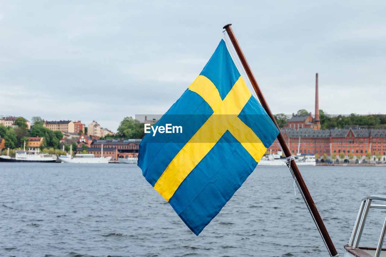 Swedish flag against sea