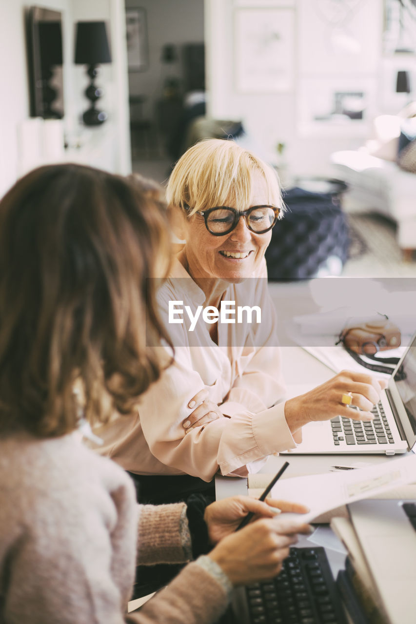 Female coworkers working from home