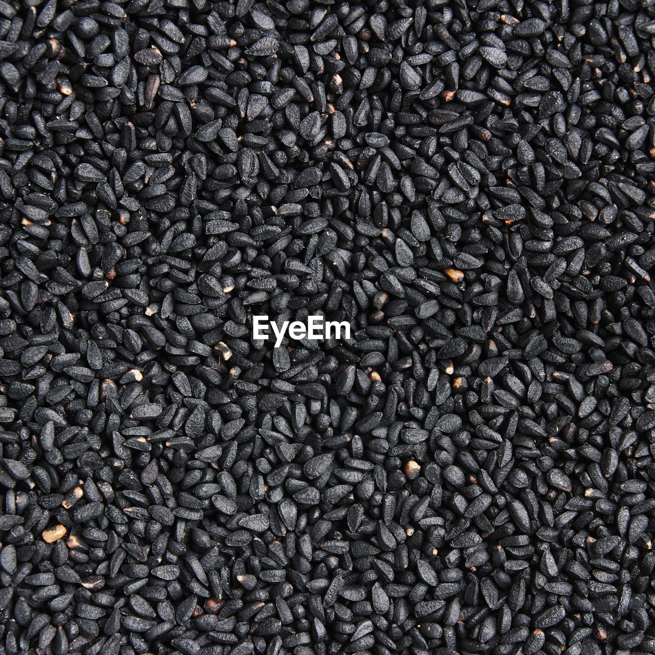 full frame, backgrounds, sunflower seed, large group of objects, soil, abundance, flooring, food and drink, no people, black, textured, food, still life, asphalt, close-up, pattern, produce, freshness, indoors, gray, directly above, heap