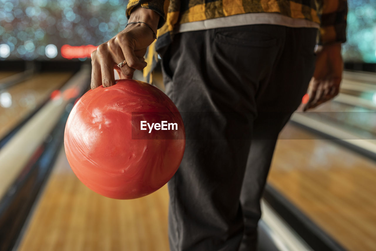 Man playing ten pin bowling