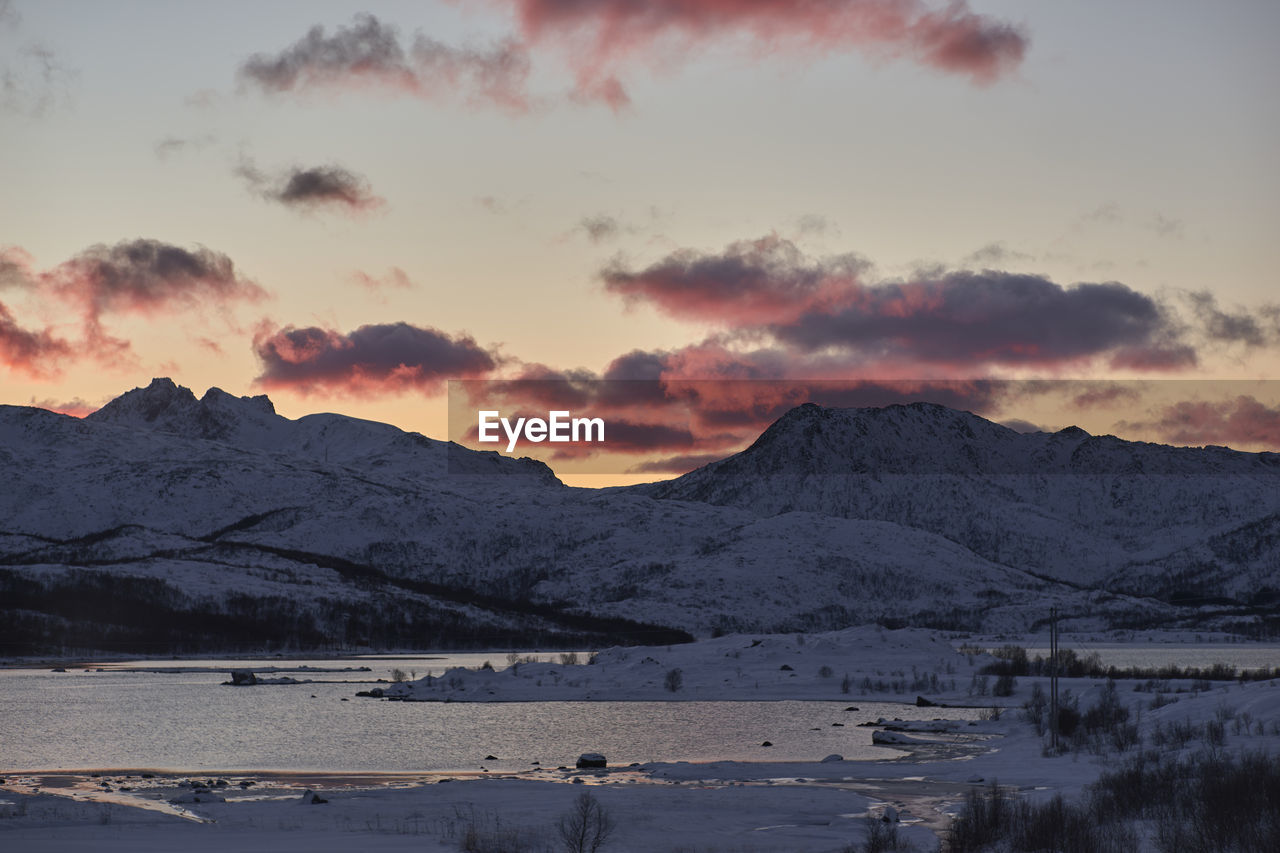 Scenic view of lake against sky during sunset