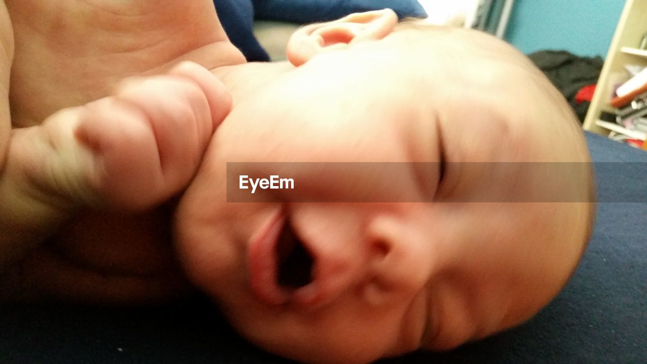 CLOSE-UP OF HANDS WITH BABY