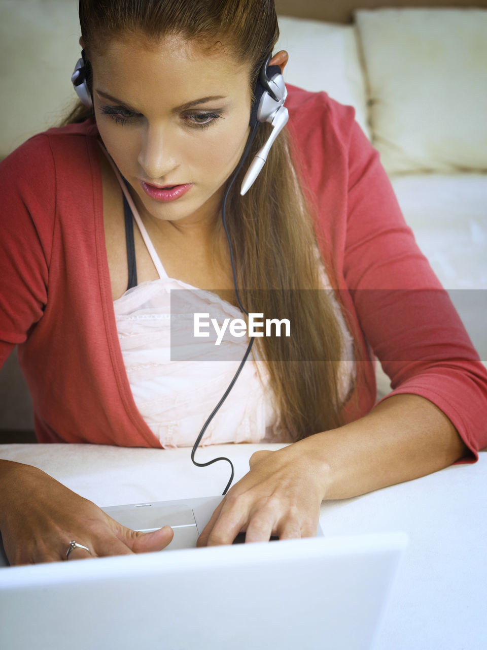 Young woman using laptop at home