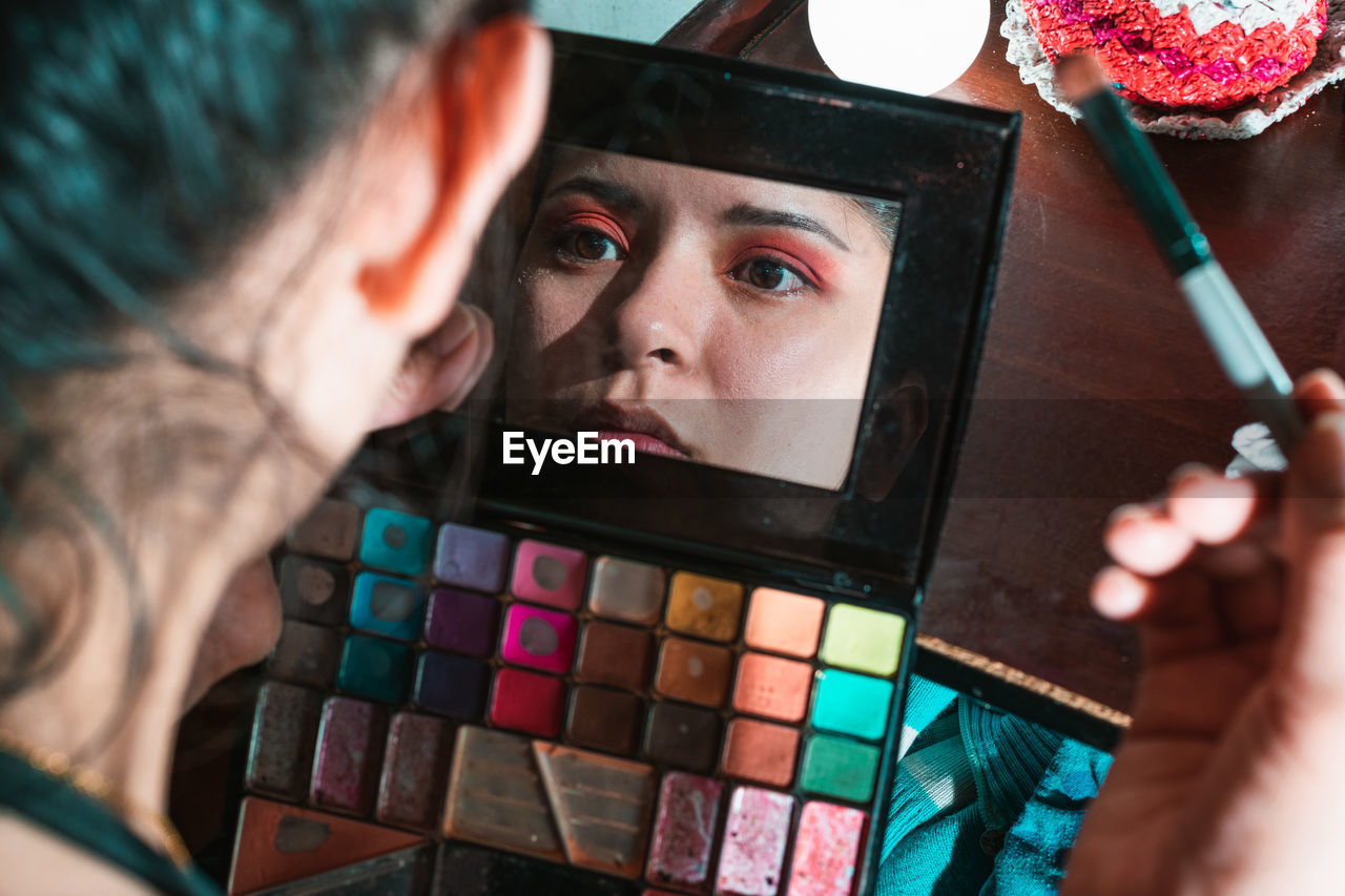 adult, men, portrait, rubik's cube, indoors, two people, multi colored, headshot, arts culture and entertainment, holding, women, close-up, human eye