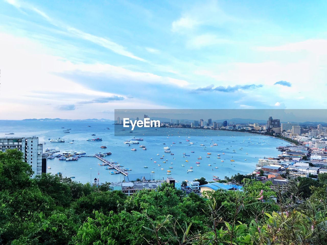 High angle view of bay and city against sky