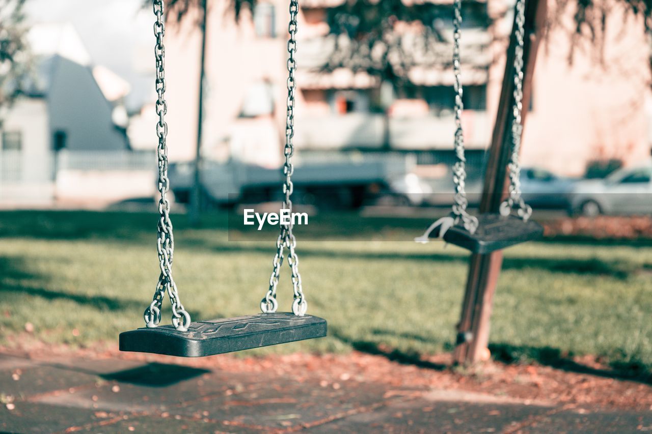 Close-up of empty swing in playground