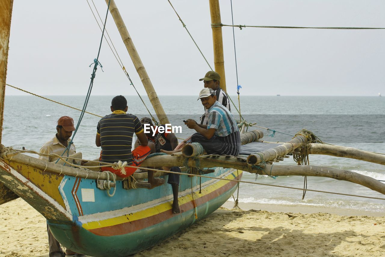 BOATS IN SEA WITH BOATS IN BACKGROUND