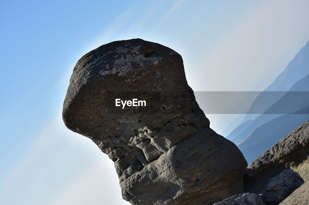 LOW ANGLE VIEW OF ROCK FORMATIONS