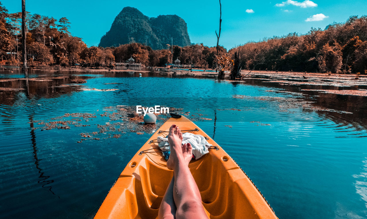 Low section of woman relaxing in boat