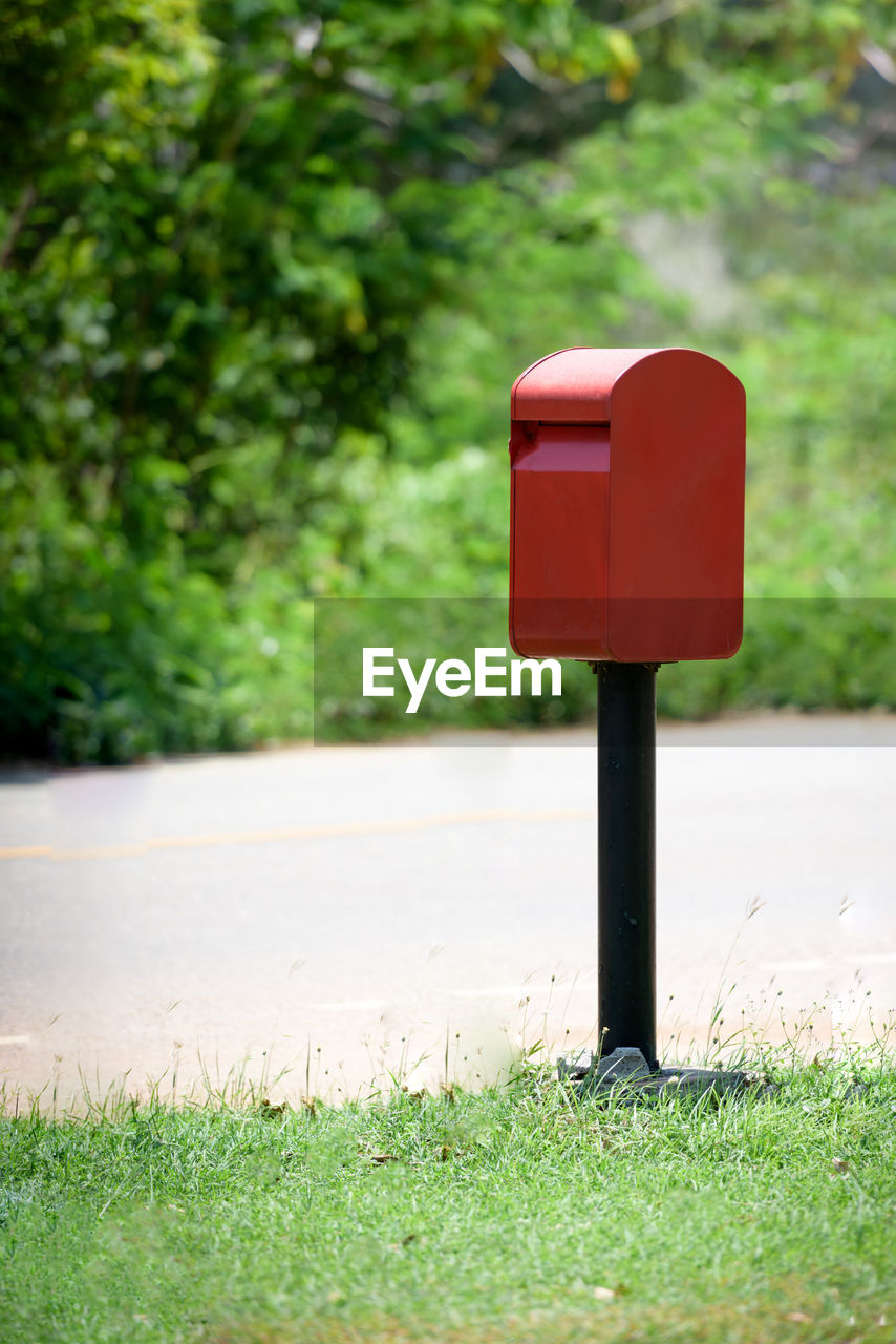 Red mailbox on roadside