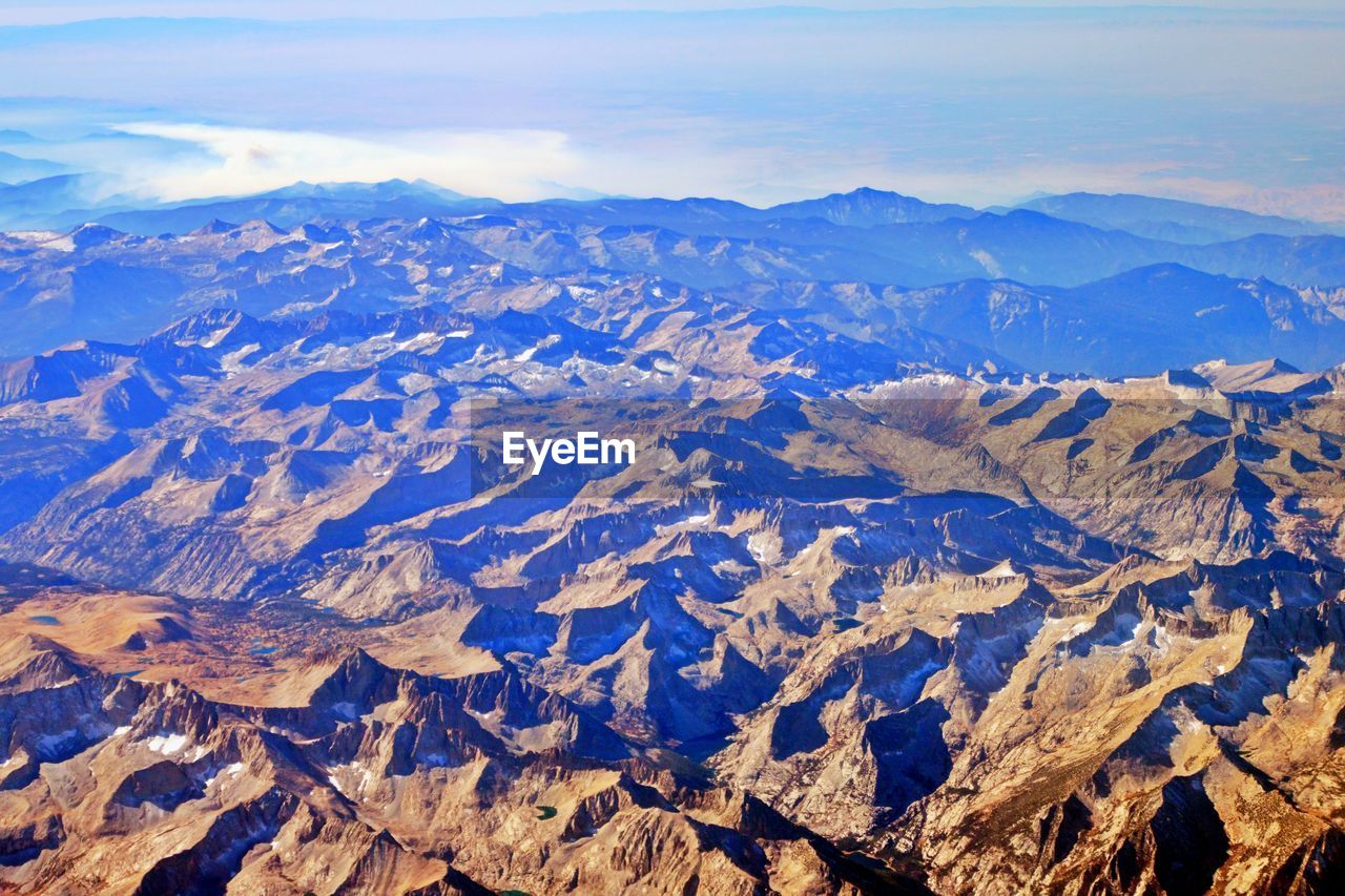 AERIAL VIEW OF SNOWCAPPED MOUNTAINS