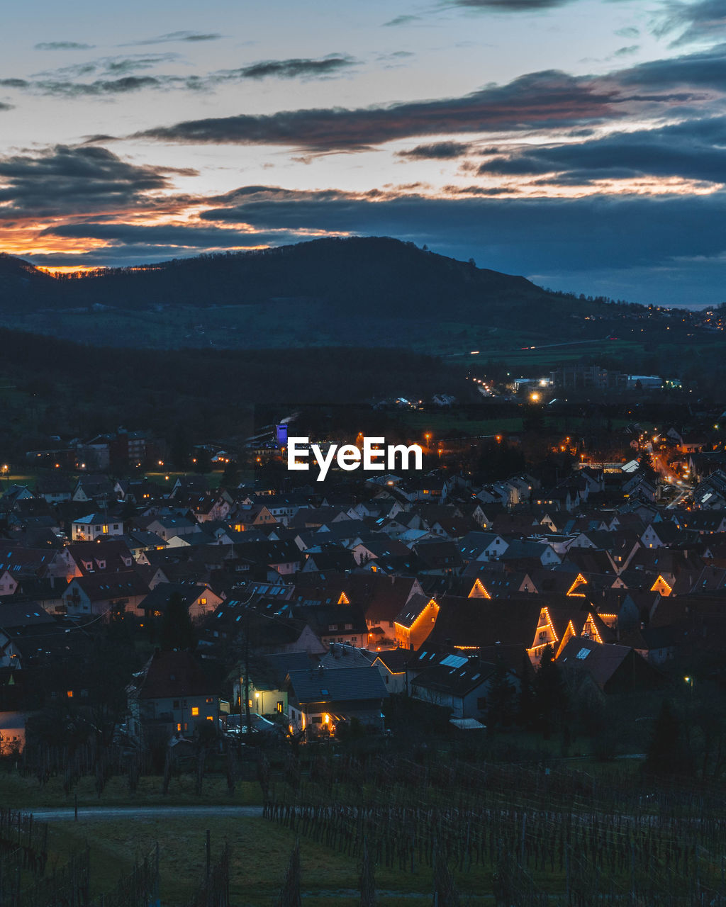 High angle shot of townscape against sky at sunset