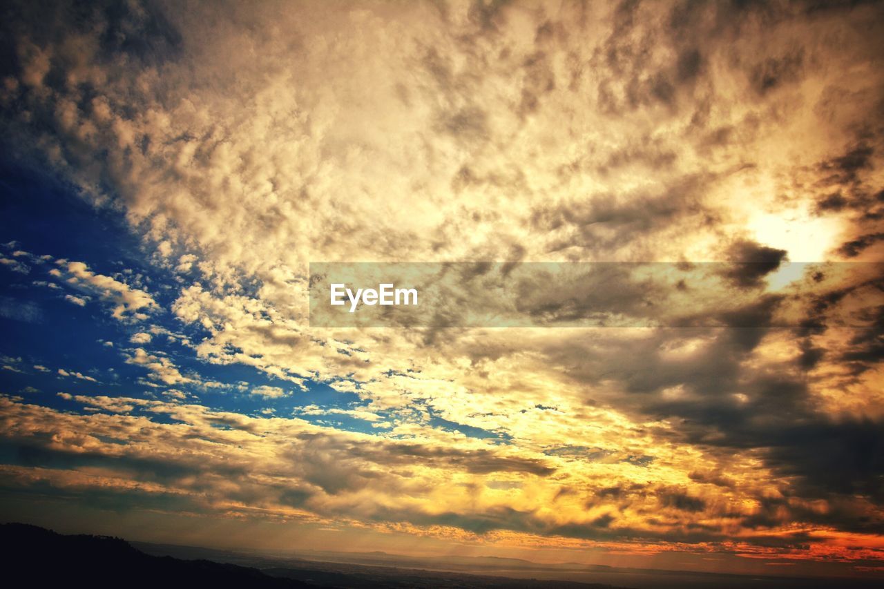 Low angle view of cloudy sky during sunset