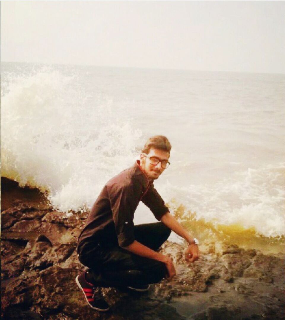 WOMAN STANDING ON SHORE