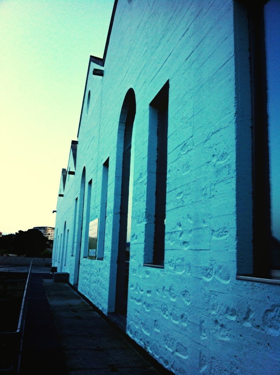 VIEW OF BUILDINGS AGAINST BLUE SKY