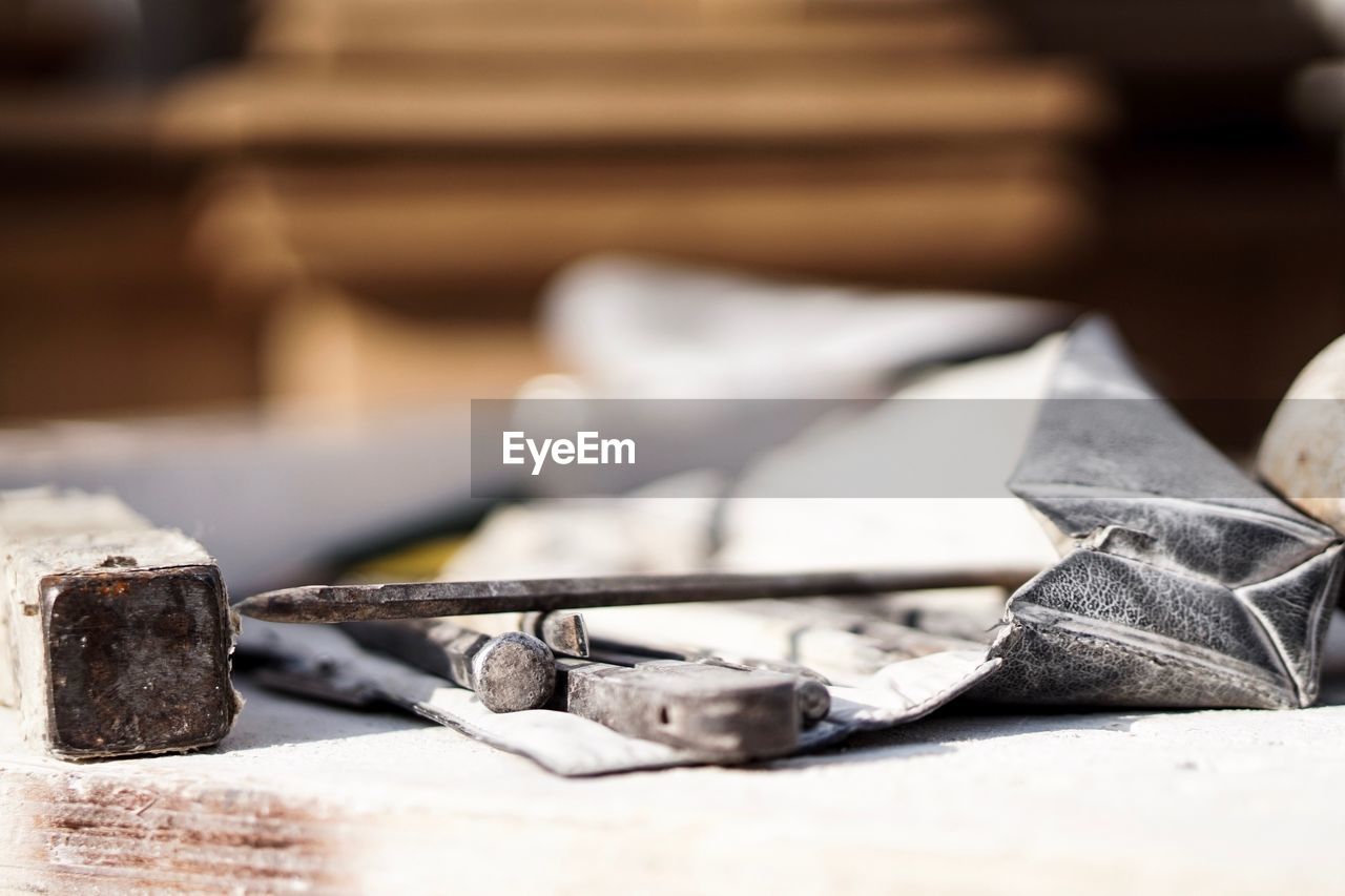 Close-up of work tools on table