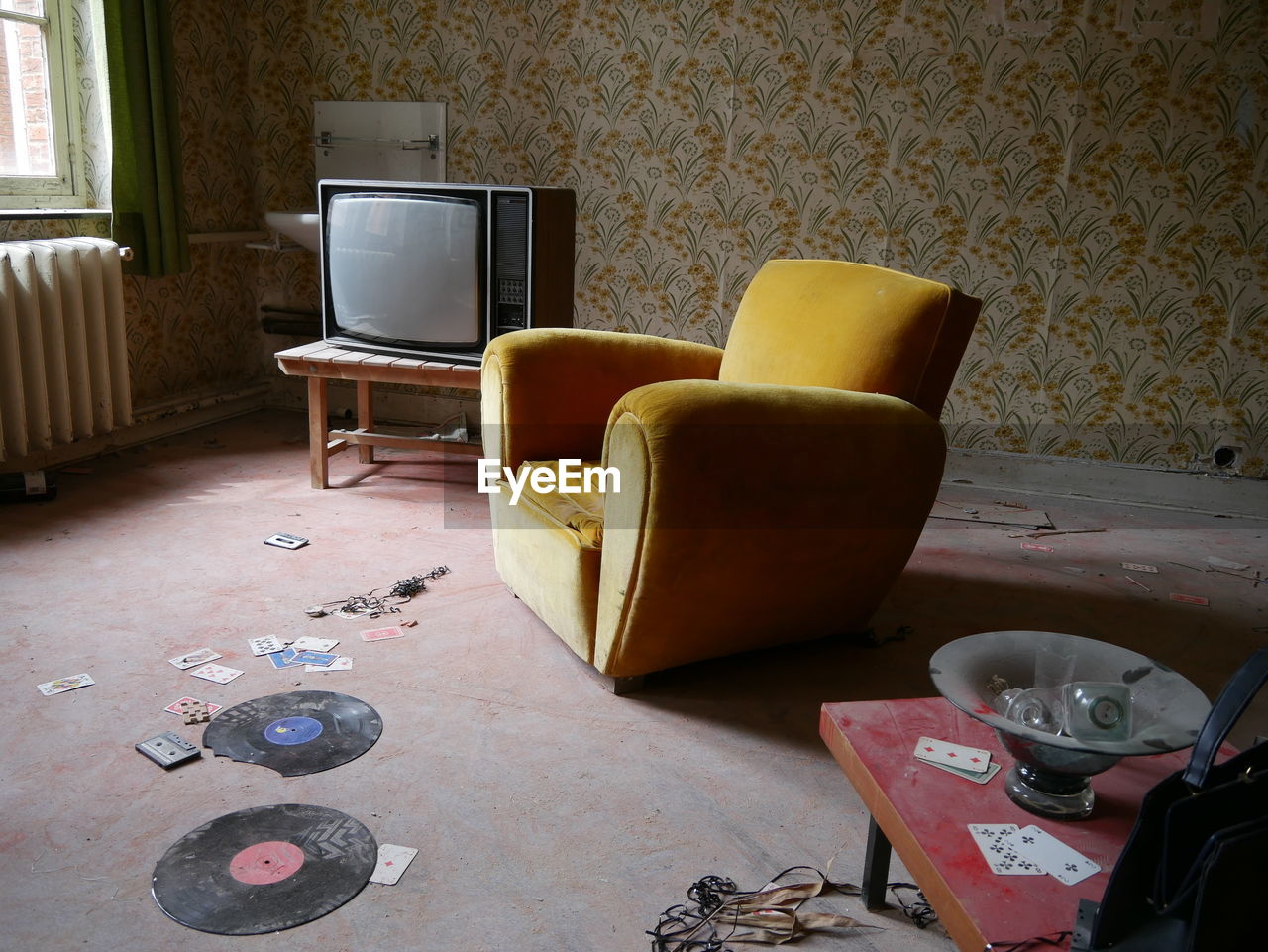 Empty couch with old television set in living room