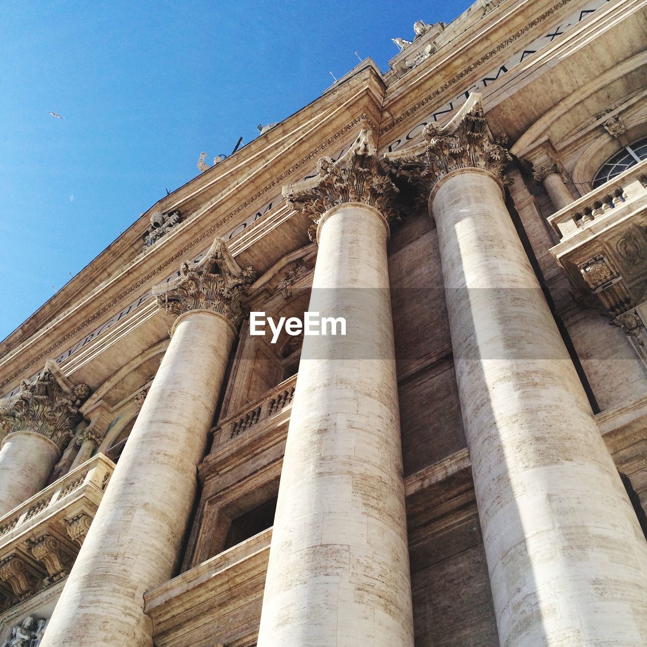 Exterior of st peters basilica against clear blue sky