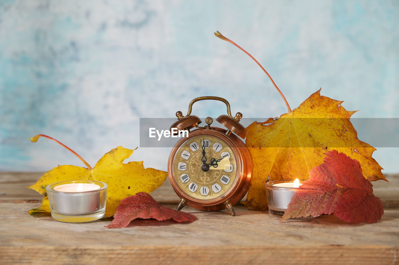 yellow, time, clock, alarm clock, autumn, no people, wood, studio shot, still life, food and drink, indoors, table, nature, clock face, morning, food, leaf, plant part