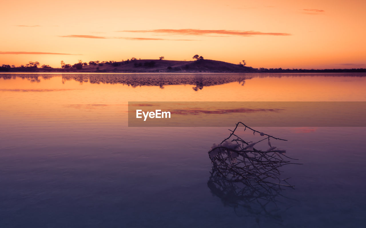 SCENIC VIEW OF LAKE DURING SUNSET