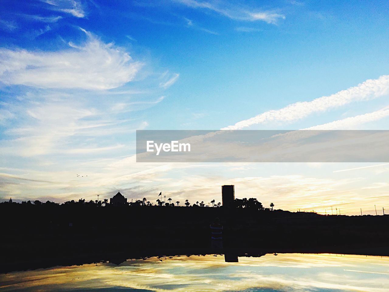 SCENIC VIEW OF RIVER AT SUNSET