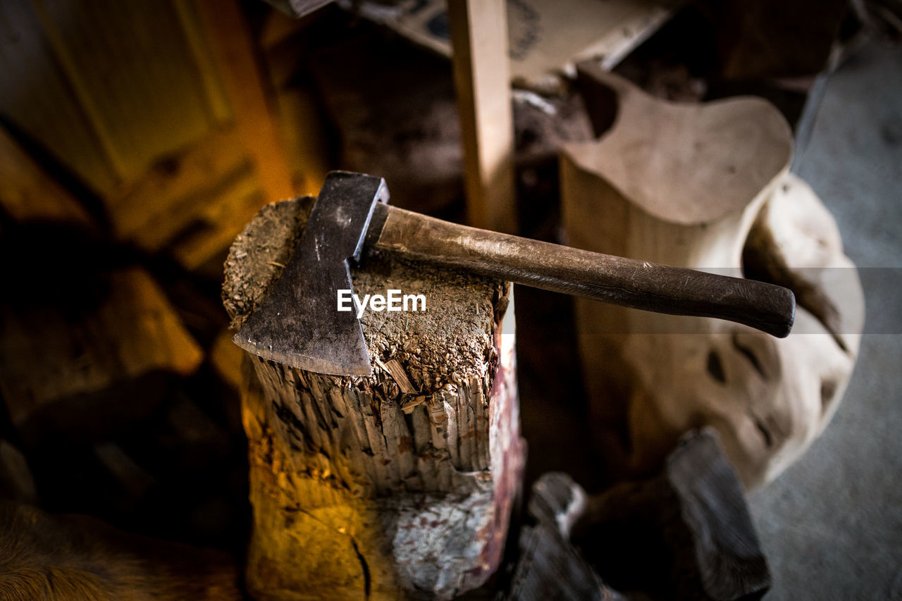 High angle view of axe on wood