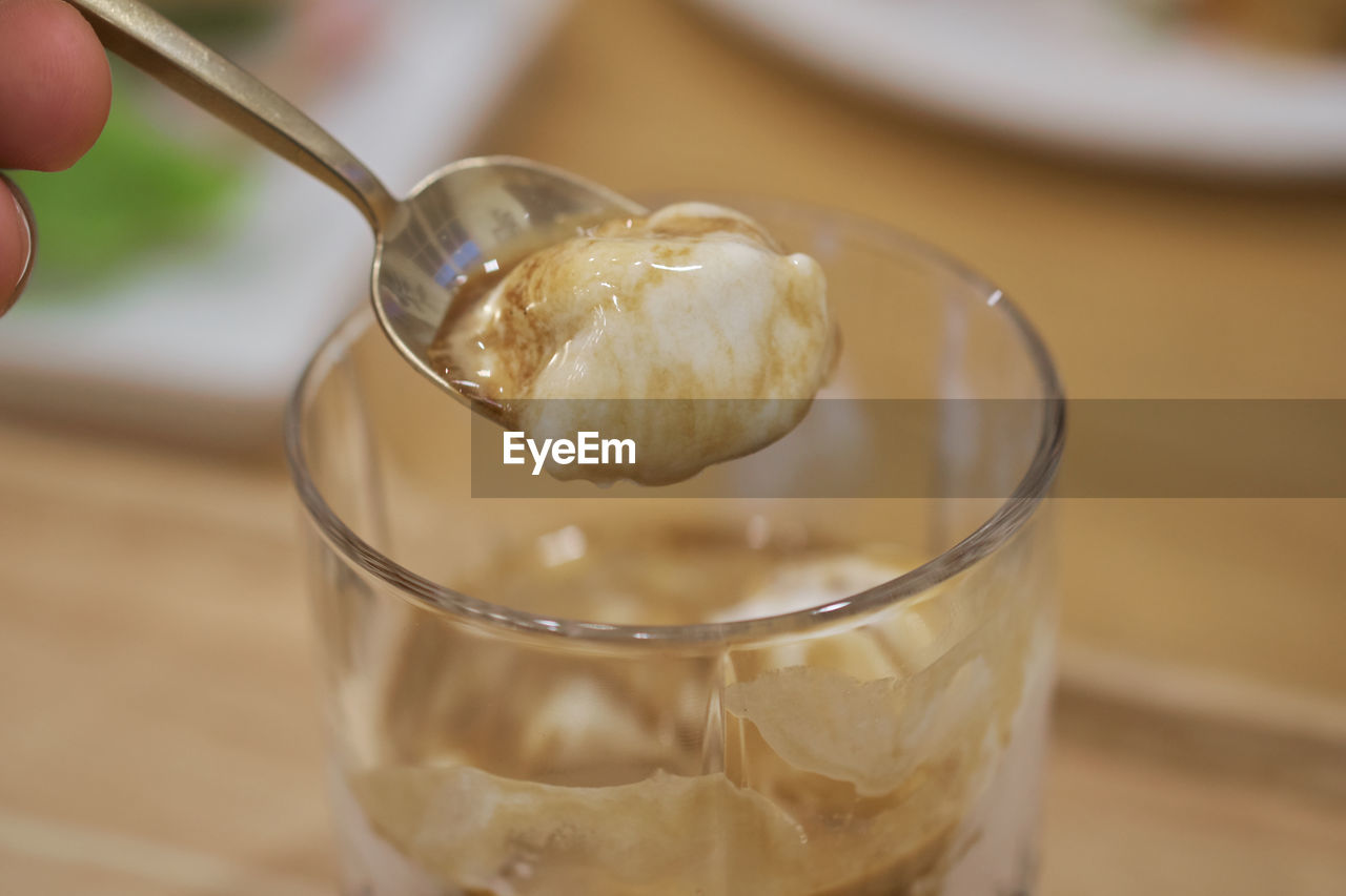 CLOSE-UP OF ICE CREAM IN GLASS