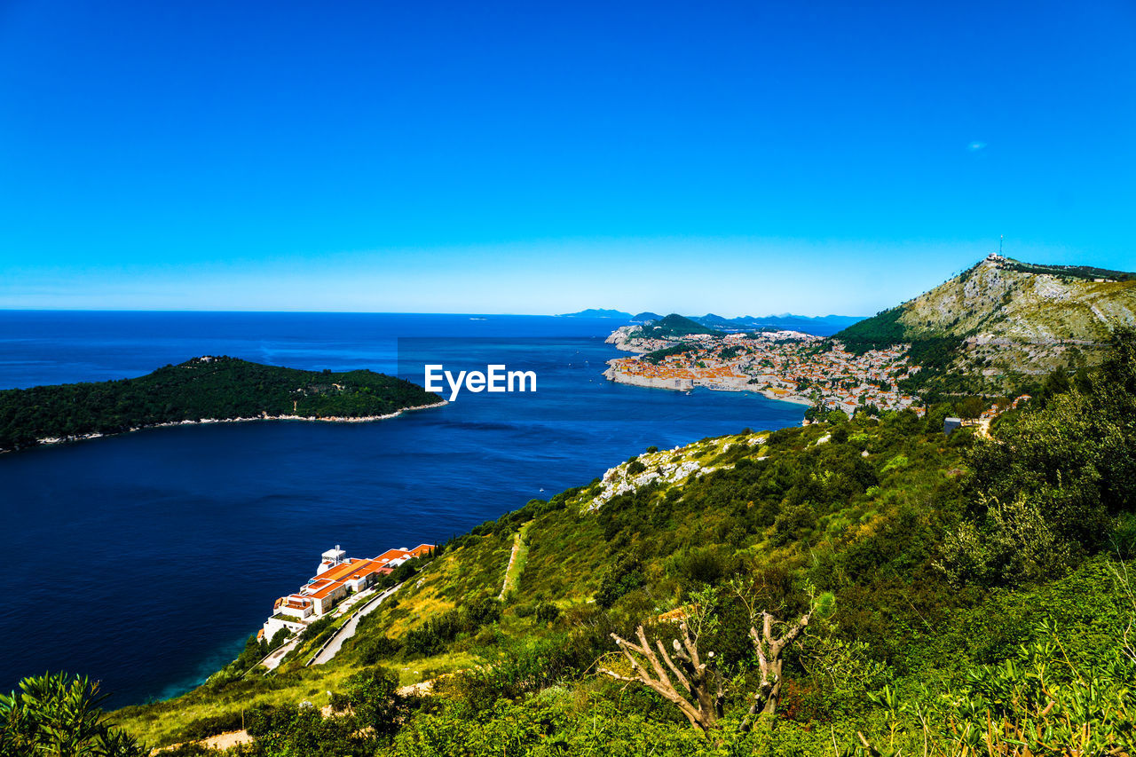 Scenic view of sea against blue sky