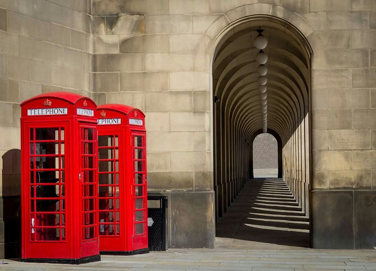 Telephone booths beside long corridor