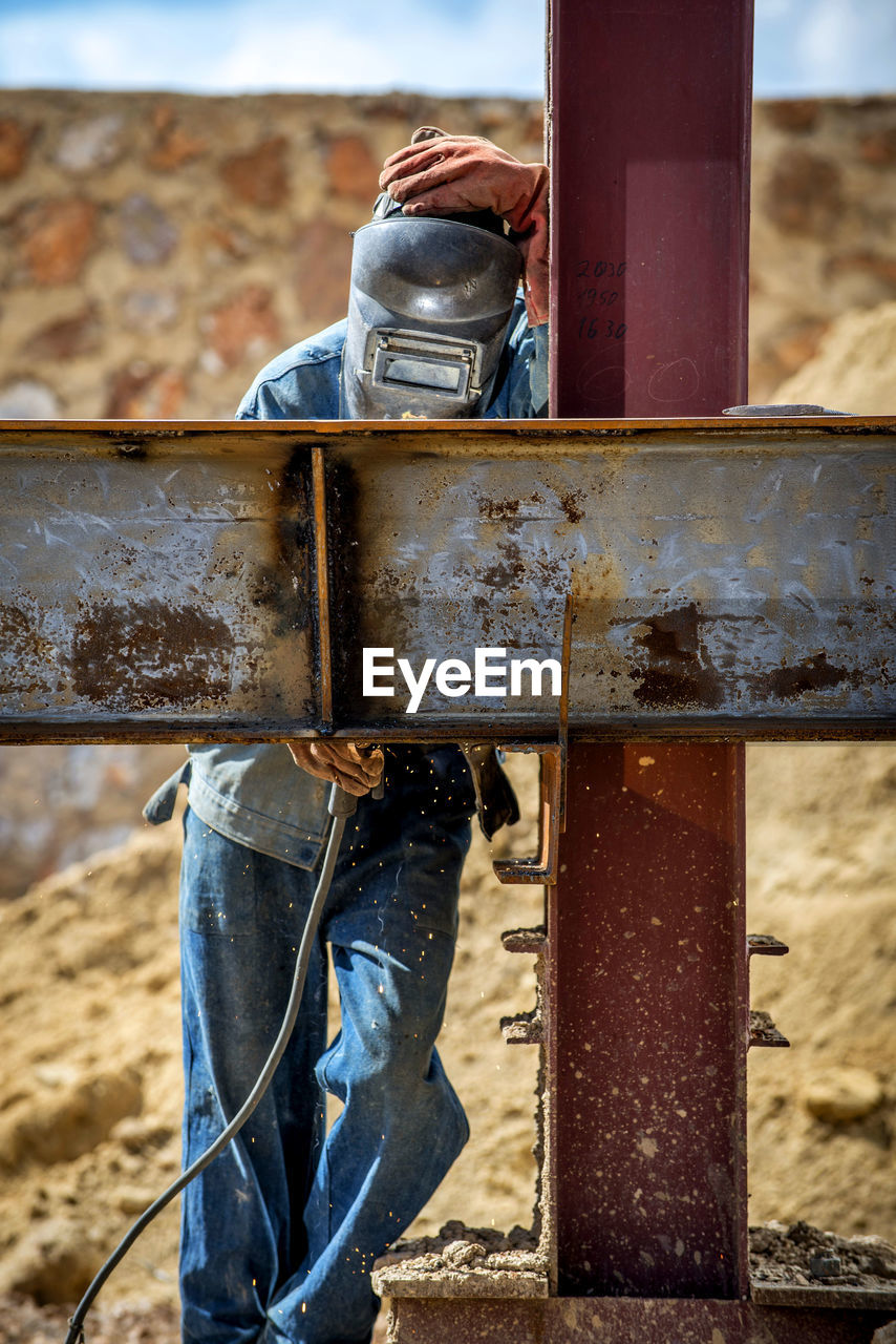 Welder working at construction site