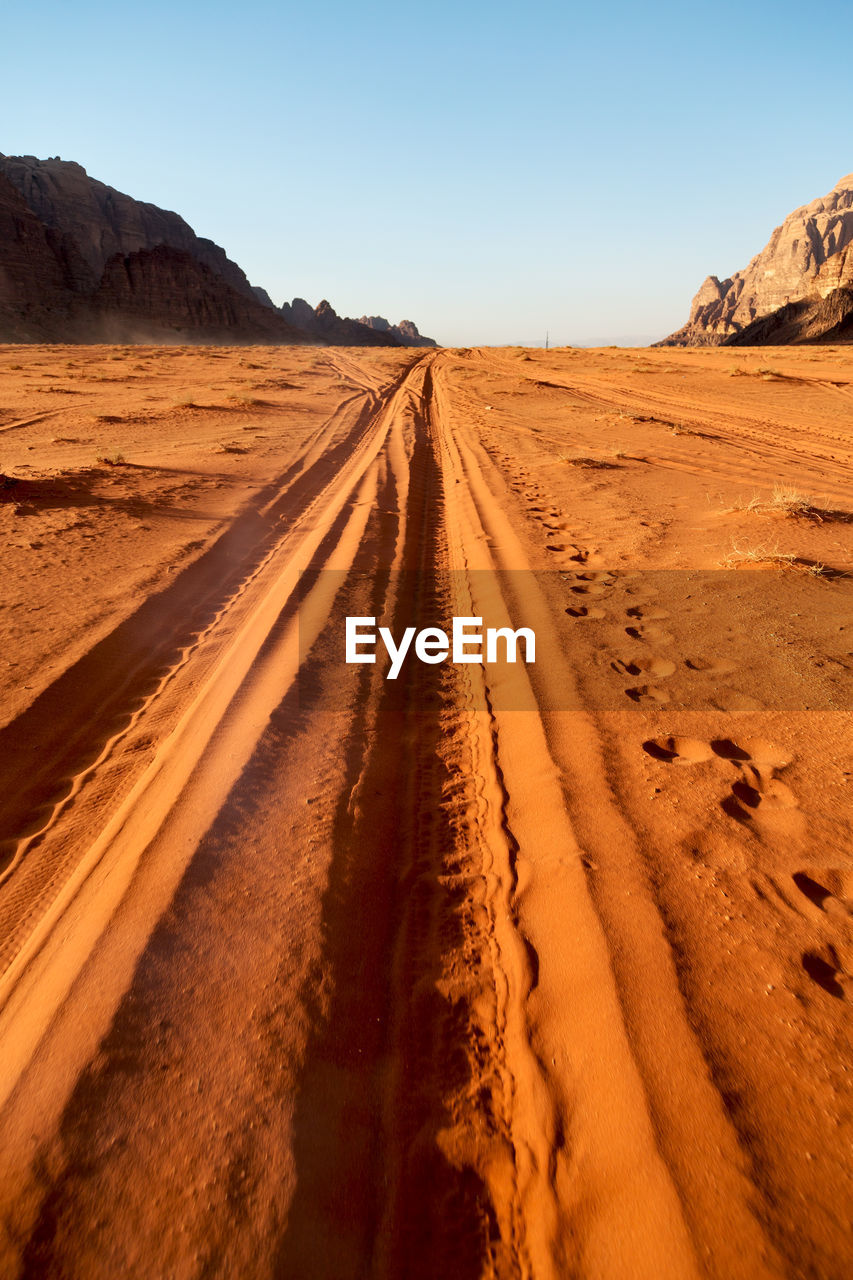 Scenic view of desert against clear sky