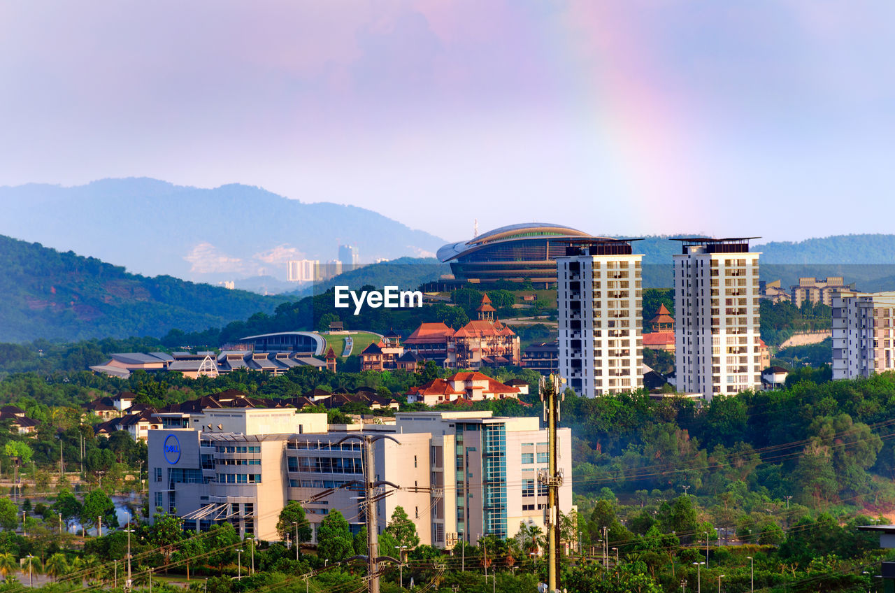 Buildings in city against sky