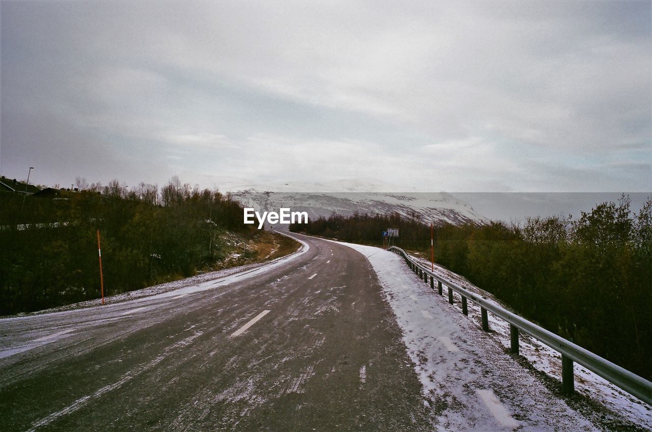 Empty road against sky