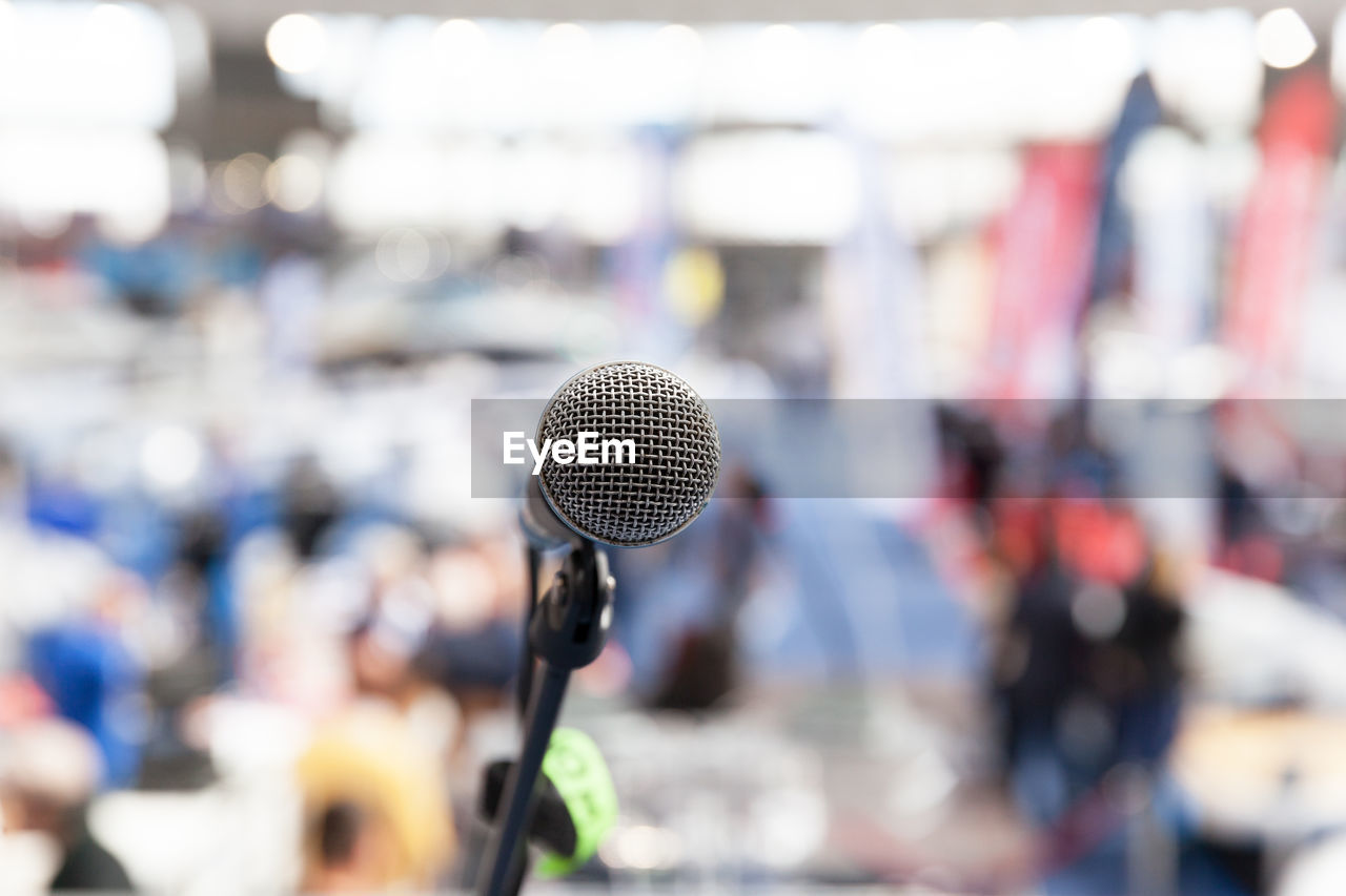 Close-up of microphone against blurred background