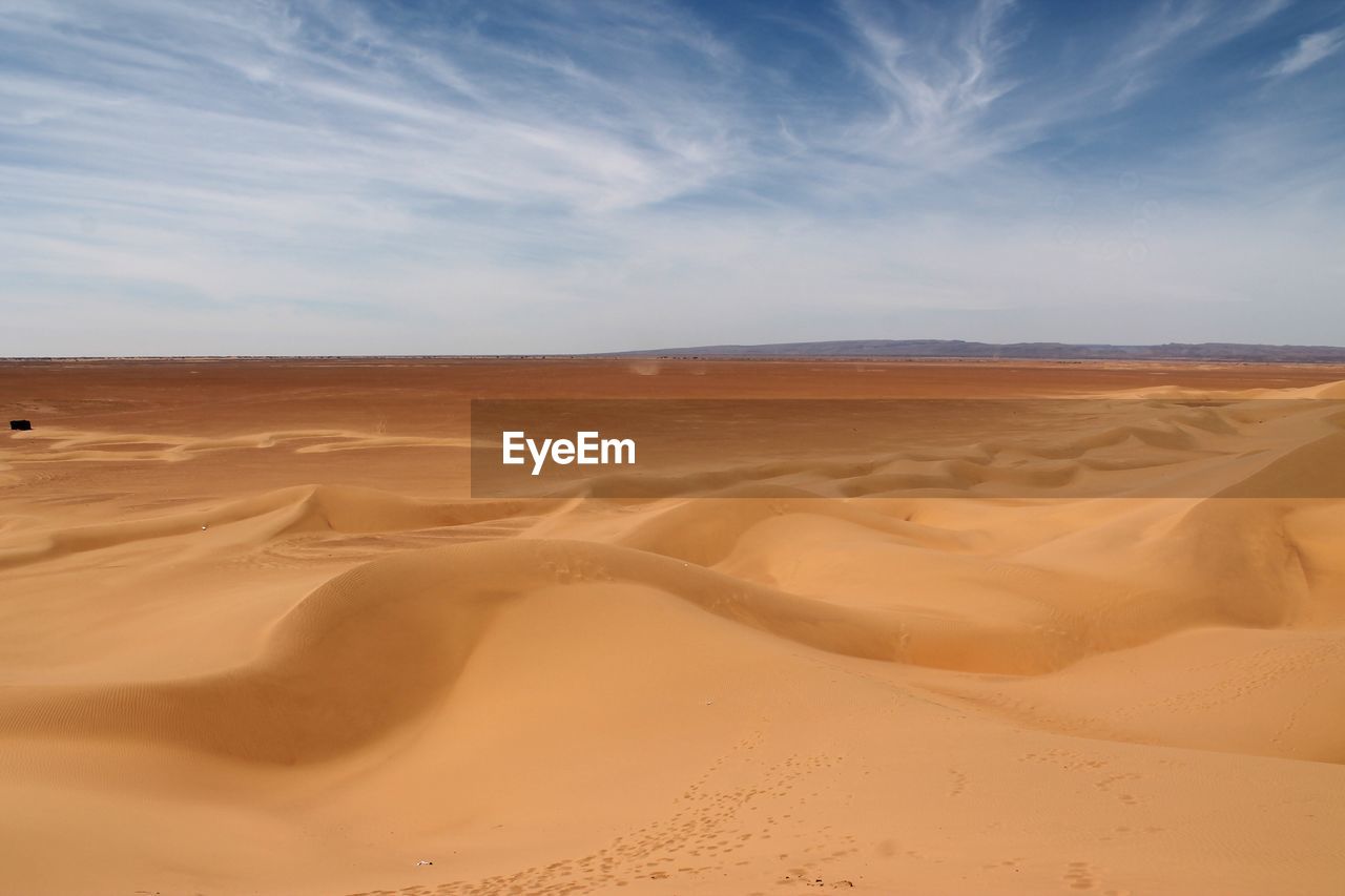 Scenic view of desert against sky