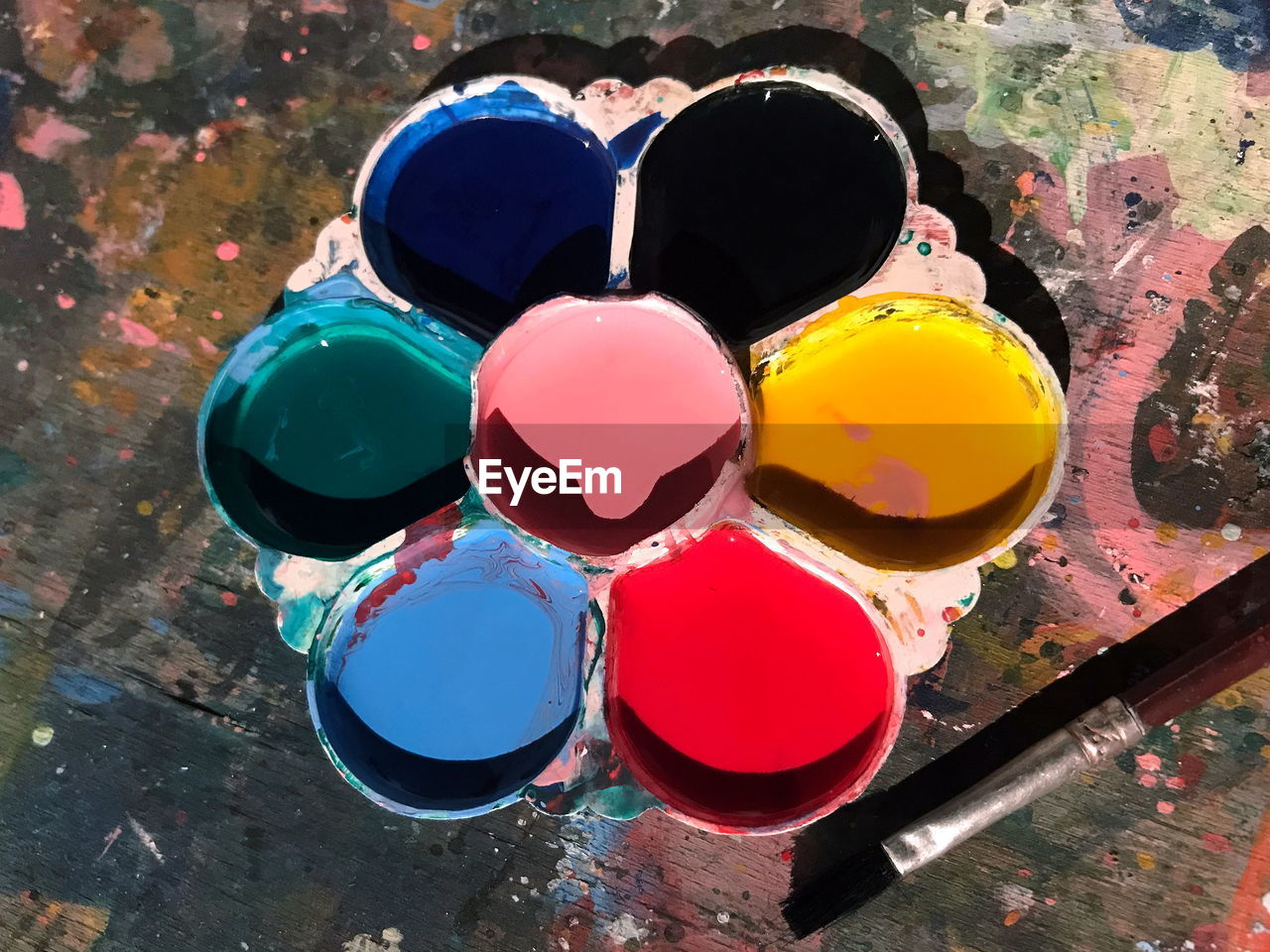 High angle view of watercolor paints on table