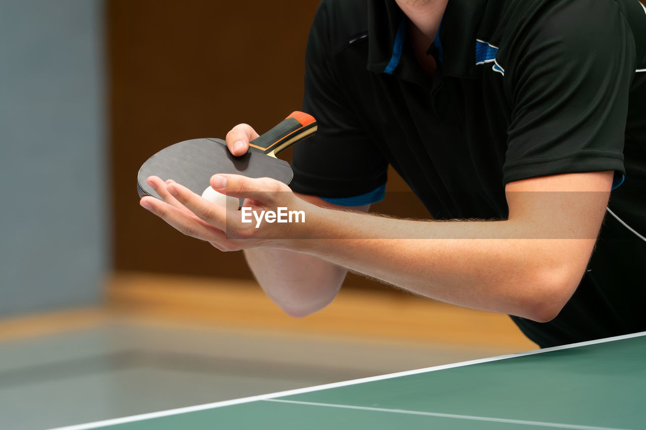 Close up of a table tennis player serving