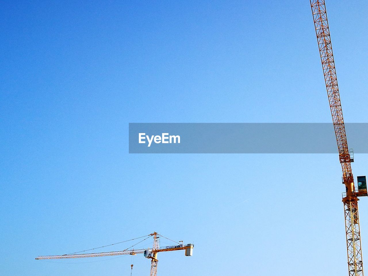 LOW ANGLE VIEW OF COMMUNICATIONS TOWER AGAINST CLEAR SKY