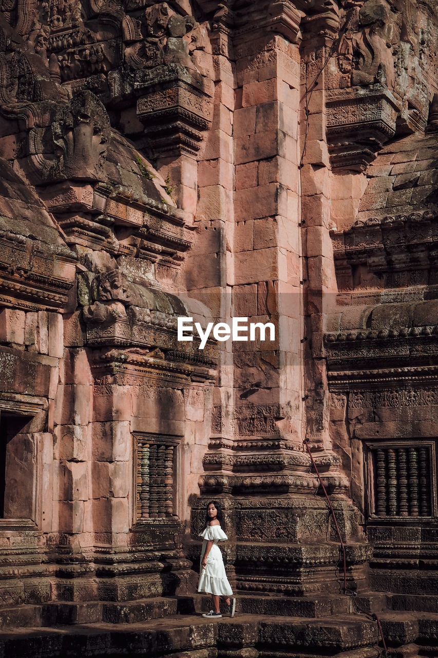 Full length of man outside temple against building