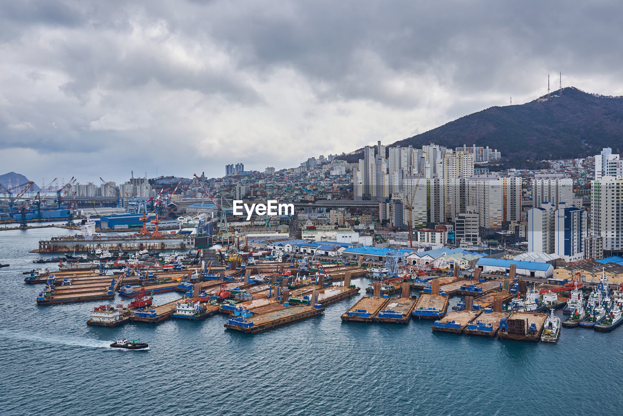 high angle view of buildings in city against sky